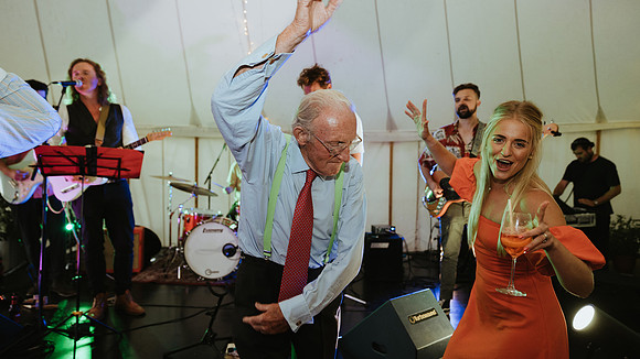 A fun and colourful and relaxed festival style wedding celebration in Horsted Keynes, West Sussex