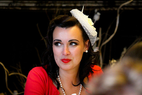 A wedding guest in a 50's style outfit
