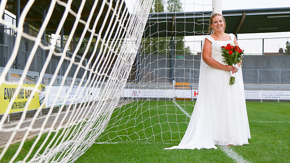 Bridal portrait at Dartford football club in the goal mouth