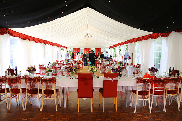 A beautifully decorated marquee for a wedding reception