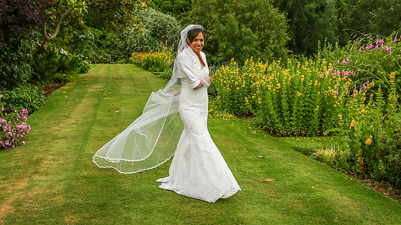 Bride and veil in the Headmasters garden, Ardingly College, Ardingly, Sussex